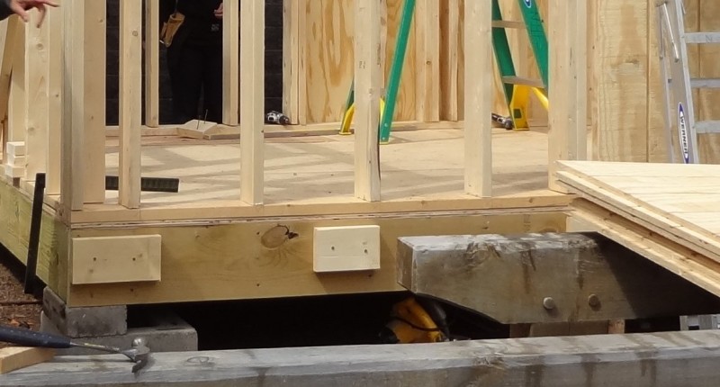 Wood blocks used as temporary wall panel supports