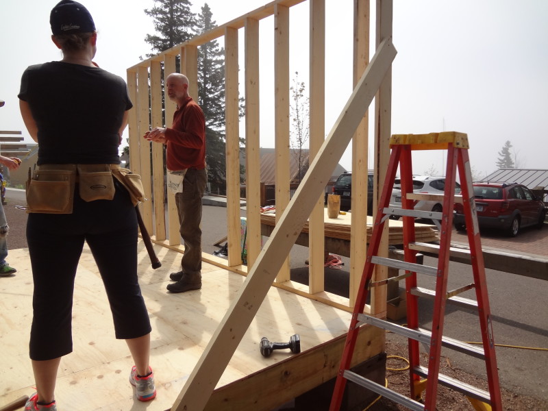 Temporary boards hold wall frame in place