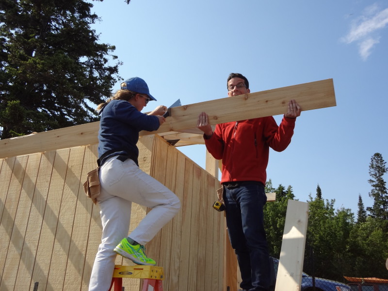 Cutting the fascia to size. Use something sharp - a hand saw, your teeth, whatever you got.