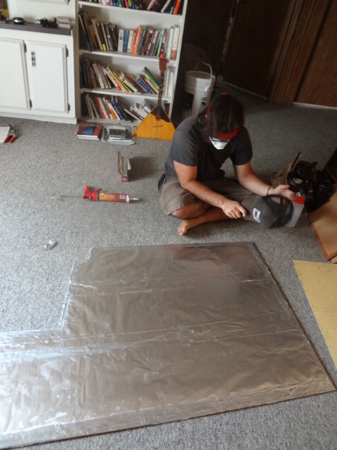 Lining cement board with aluminum foil (shiny side towards the fire)