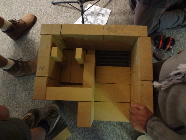 Layer 4, almost complete. Just needs one more brick laid on its long narrow side, next to the right vertical soap. (Note the photo oriention has changed. The front of the firebox is now at the bottom of the picture. )