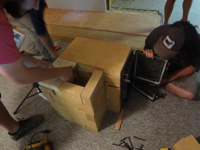 Brick covering the left portion of the throat that leads to the combustion chamber