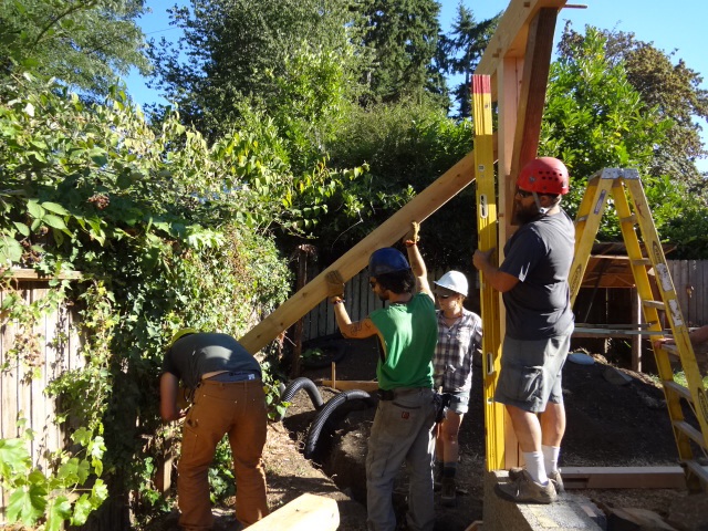 Back wall plumbed and secured temporarily to a fence post
