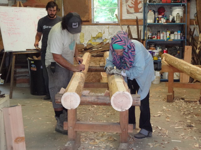 Creating a level flat surface on one side of the poles. This roof will be placed on this surface.