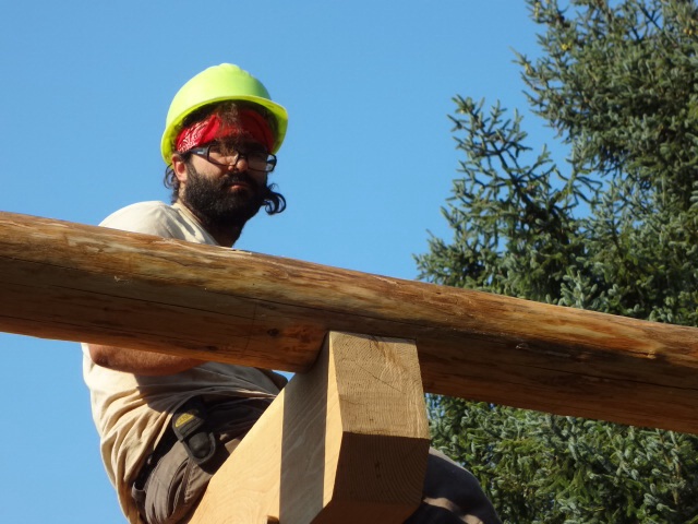 After the scribed lines are cut, Justin and the rafter sit nicely on the beam.