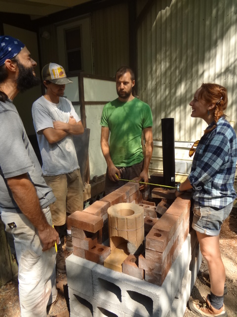 Pre-made insulated combustion chamber sits towards the front of the stove