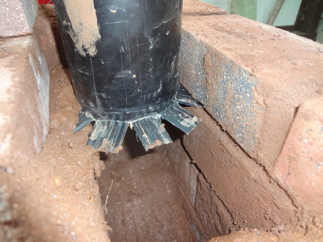Setting the chimney into the stove